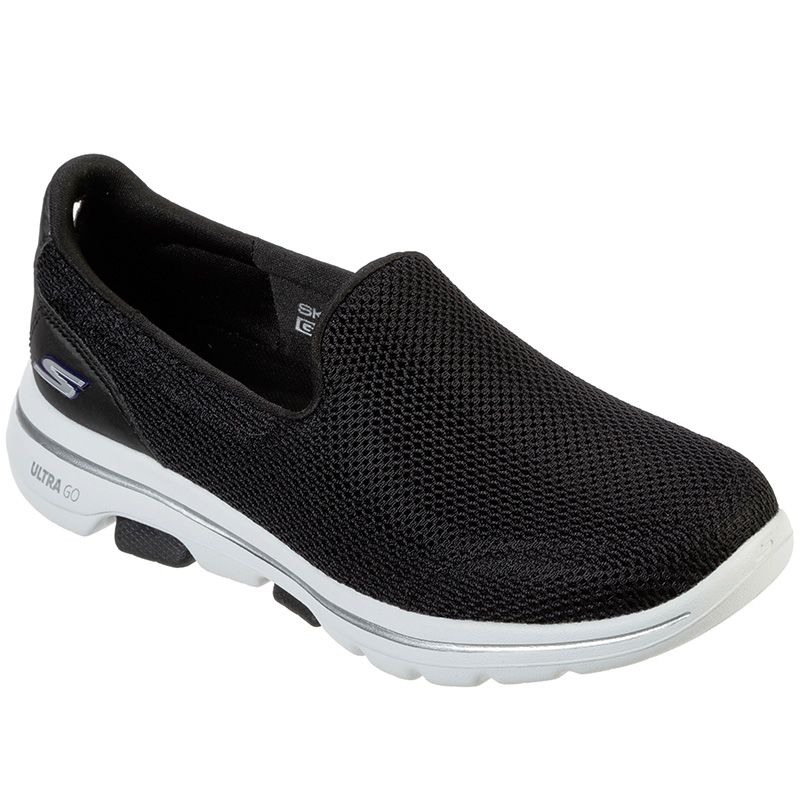 black and white skechers trainers